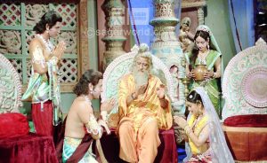 Guru Vasistha is giving blessings to Ram,Lakshman,Sita and Urmila